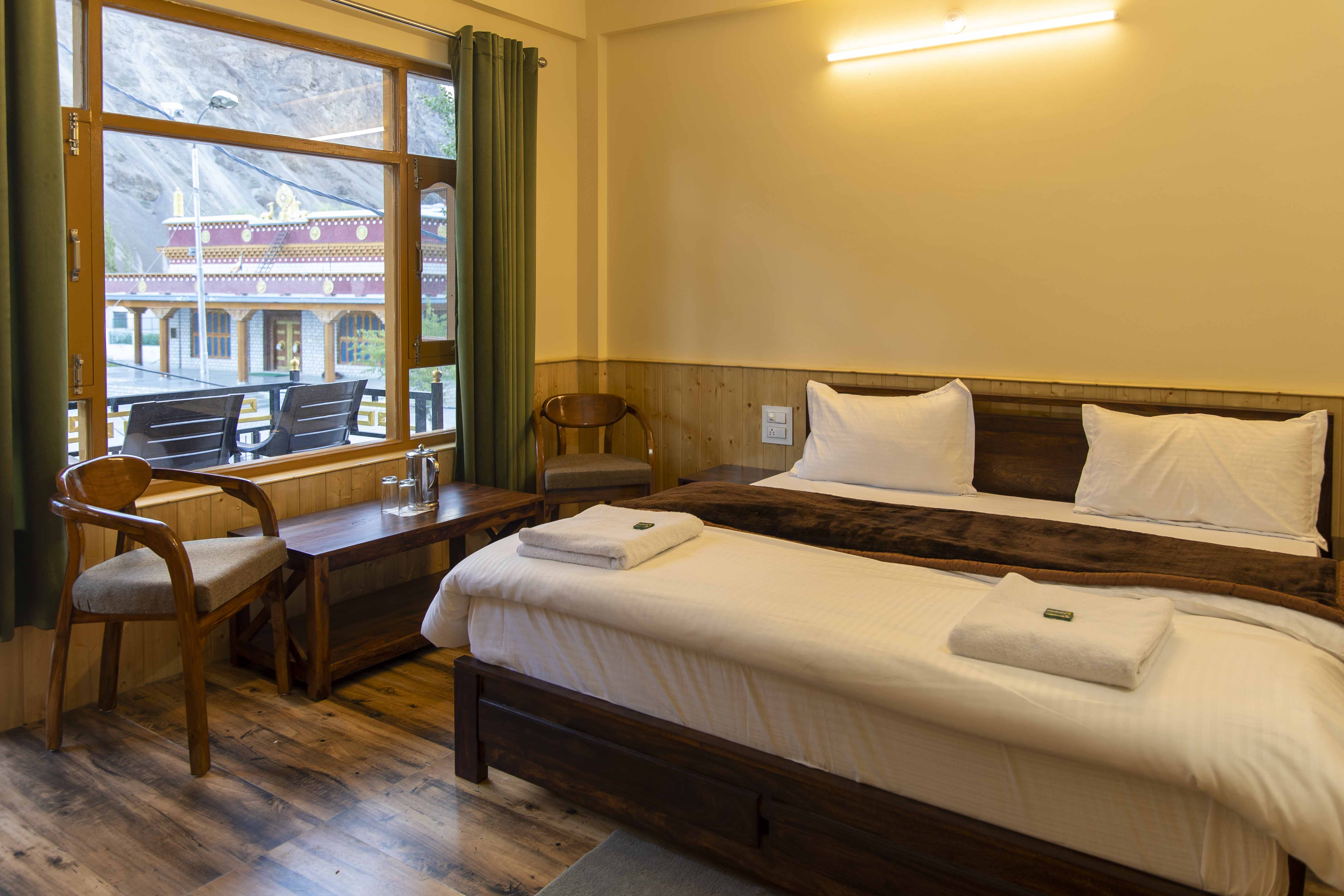 Guest room with double bed and wooden flooring
